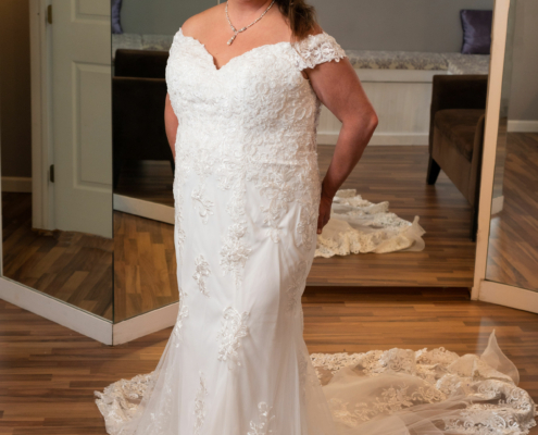 Lace wedding gown with cap sleeves